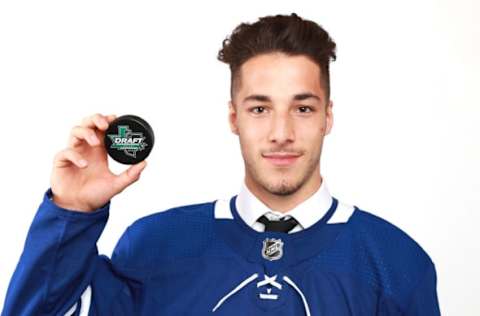 DALLAS, TX – JUNE 23: Sean Durzi poses after being selected 52nd overall by the Toronto Maple Leafs during the 2018 NHL Draft at American Airlines Center on June 23, 2018 in Dallas, Texas. (Photo by Tom Pennington/Getty Images)