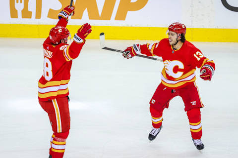 May 3, 2022; Calgary, Alberta, CAN; Calgary Flames center Elias Lindholm (28) celebrates his goal with left wing Johnny Gaudreau (13) during the first period against the Dallas Stars in game one of the first round of the 2022 Stanley Cup Playoffs at Scotiabank Saddledome. Mandatory Credit: Sergei Belski-USA TODAY Sports