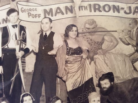 Close-up of a 1932 group photo of sideshow performers, with Agnes the Rubber Skin Lady featured in the center.