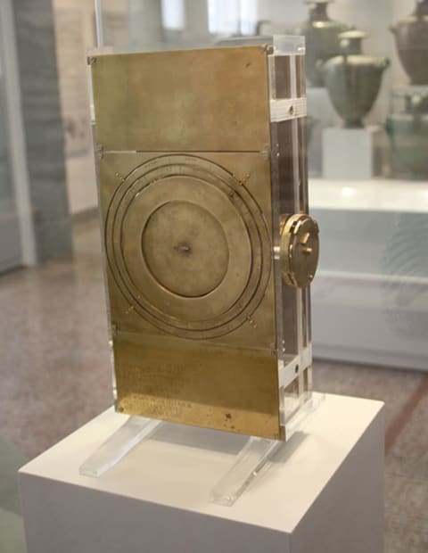 This image shows the back of a replica Antikythera mechanism in the National Archaeological Museum in Athens.