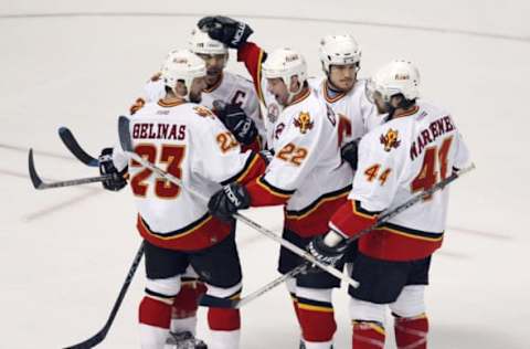 TAMPA, FL – MAY 25: Craig Conroy #22 and Jarome Iginla #12 of the Calgary Flames celebrate with teammate Martin Gelinas #23 after Gelinas scored the team’s first goal against the Tampa Bay Lightning in game one of the NHL Stanley Cup Finals on May 25, 2004 at the St. Pete Times Forum in Tampa, Florida. (Photo by Jeff Gross/Getty Images)