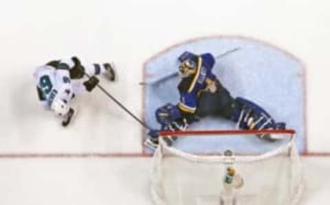 May 17, 2016; St. Louis, MO, USA; St. Louis Blues goalie Brian Elliott (1) makes a save against San Jose Sharks right wing Melker Karlsson (68) in game two of the Western Conference Final of the 2016 Stanley Cup Playoff at Scottrade Center. The Sharks won 4-0. Mandatory Credit: Aaron Doster-USA TODAY Sports