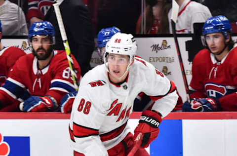 MONTREAL, QC – OCTOBER 21: Martin Necas #88 of the Carolina Hurricanes skates the puck against the Montreal Canadiens during the third period at Centre Bell on October 21, 2021, in Montreal, Canada. The Carolina Hurricanes defeated the Montreal Canadiens 4-1. (Photo by Minas Panagiotakis/Getty Images)