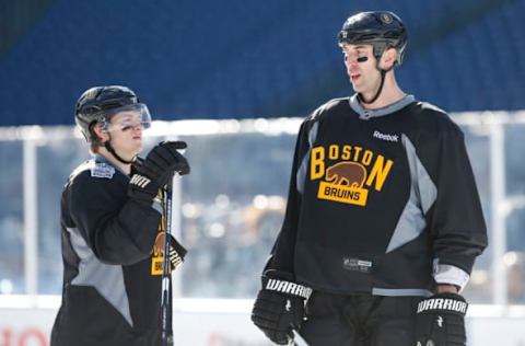 Dec 31, 2015; Foxborough, MA, USA; Boston Bruins defenseman Zdeno Chara (33) talks to defenseman Torey Krug (47) during practice the day prior to the Winter Classic hockey game at Gillette Stadium. Mandatory Credit: Greg M. Cooper-USA TODAY Sports