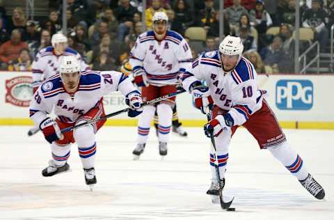 Nov 21, 2016; Pittsburgh, PA, USA; New York Rangers left wing J.T. Miller (10) skates with the puck alongside right wing Chris Kreider (20) against the Pittsburgh Penguins during the first period at the PPG Paints Arena. The Rangers won 5-2. Mandatory Credit: Charles LeClaire-USA TODAY Sports