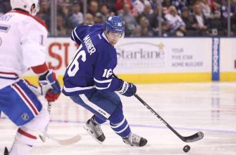 Oct 2, 2016; Toronto, Ontario, CAN; Toronto Maple Leafs forward Mitch Marner (16) controls the puck against the Montreal Canadiens during a preseason hockey game at Air Canada Centre. The Maple Leafs beat the Canadiens 3-2 in overtime. Mandatory Credit: Tom Szczerbowski-USA TODAY Sports