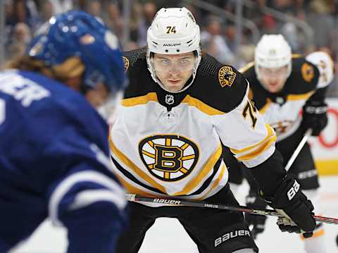 TORONTO, ON – OCTOBER 19: Jake DeBrusk #74 of the Boston Bruins waits for a puck drop against the Toronto Maple Leafs during an NHL game at Scotiabank Arena on October 19, 2019 in Toronto, Ontario, Canada. The Maple Leafs defeated the Bruins 4-3 in overtime. (Photo by Claus Andersen/Getty Images)