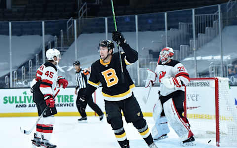 Feb 18, 2021; Boston, Massachusetts, USA; Boston Bruins left wing Nick Ritchie (21) reacts on a goal past New Jersey Devils goaltender Mackenzie Blackwood (29) by defenseman Charlie McAvoy (73) (not pictured) during the third period at TD Garden. Mandatory Credit: Bob DeChiara-USA TODAY Sports