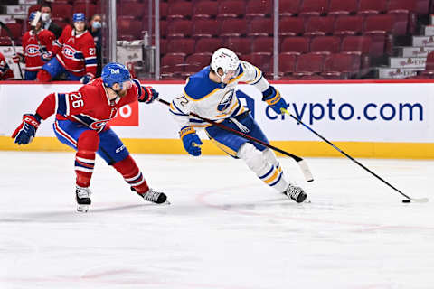 MONTREAL, QC – FEBRUARY 13: Tage Thompson #72 of the Buffalo Sabres skates the puck against Jeff Petry #26 of the Montreal Canadiens during the third period at Centre Bell on February 13, 2022 in Montreal, Canada. The Buffalo Sabres defeated the Montreal Canadiens 5-3. (Photo by Minas Panagiotakis/Getty Images)