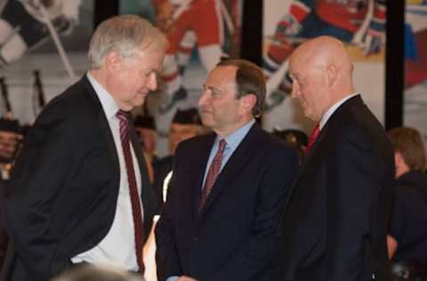 TORONTO, ON – SEPTEMBER 24: NHLPA executive director Donald Fehr (left) walks past NHL Commissioner Gary Bettman (middle) and National Hockey League deputy commissioner Bill Daly during the NHL Alumni dinner. (Carlos Osorio/Toronto Star via Getty Images)