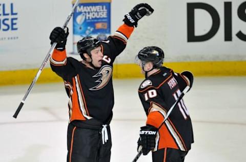 April 16, 2015; Anaheim, CA, USA; Anaheim Ducks right wing Corey Perry (10) celebrates the goal scored by center Ryan Getzlaf (15) against the Winnipeg Jets during the third period in game one of the first round of the the 2015 Stanley Cup Playoffs at Honda Center. Mandatory Credit: Gary A. Vasquez-USA TODAY Sports