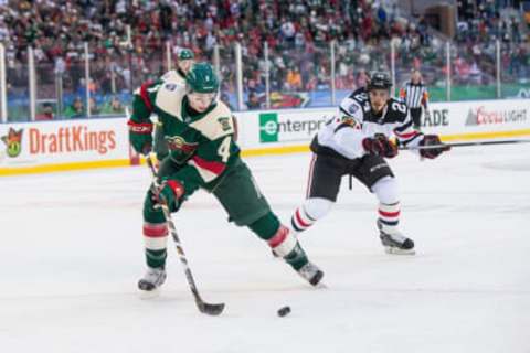 Feb 21, 2016; Minneapolis, MN, USA; Minnesota Wild defenseman Mike Reilly (4) during a Stadium Series hockey game at TCF Bank Stadium. The Minnesota Wild defeated the Chicago Blackhawks 6-1. Mandatory Credit: Brace Hemmelgarn-USA TODAY Sports