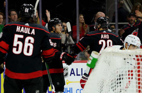 RALEIGH, NC – JANUARY 3: Teuvo Teravainen #86 of the Carolina Hurricanes scores a goal and celebrates with teammate Sebastian Aho #20 during an NHL game against the Washington Capitals on January 3, 2020, at PNC Arena in Raleigh, North Carolina. (Photo by Gregg Forwerck/NHLI via Getty Images)