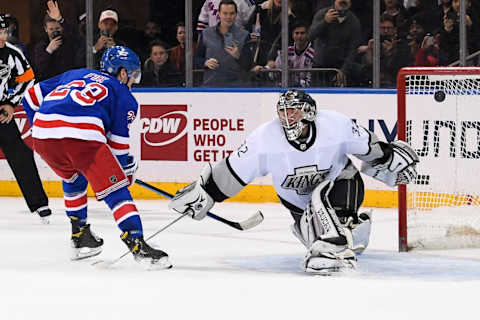 Jan 24, 2022; New York, New York, USA; New York Rangers defenseman Adam Fox (23) scores on Los Angeles Kings goaltender Jonathan Quick (32) during shootouts to win the game 3-2 at Madison Square Garden. Mandatory Credit: Dennis Schneidler-USA TODAY Sports