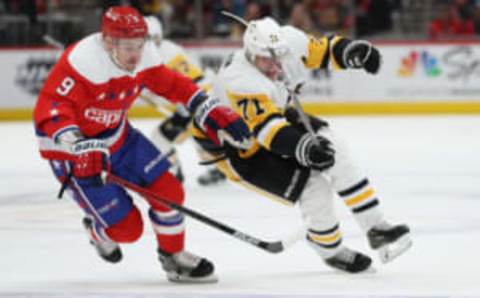 WASHINGTON, DC – FEBRUARY 23: Evgeni Malkin #71 of the Pittsburgh Penguins skates past Dmitry Orlov #9 of the Washington Capitals during the first period at Capital One Arena on February 23, 2020 in Washington, DC. (Photo by Patrick Smith/Getty Images)