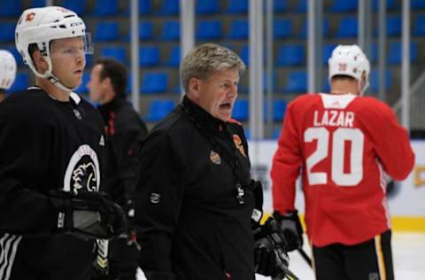 BEIJING, CHN – SEPTEMBER 17: Head coach Bill Peters of the Calgary Flames gives instructions during practice at the O.R.G. AZ Rink on September 17, 2018 in Beijing, China. (Photo by Brian Babineau/NHLI via Getty Images)