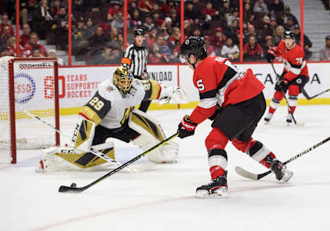 OTTAWA, ON – JANUARY 16: Ottawa Senators Defenceman Mike Reilly (5) stickhandles the puck against Vegas Golden Knights Center Chandler Stephenson (20) as Vegas Golden Knights Goalie Marc-Andre Fleury (29) tracks the puck during the second period of the NHL game between the Ottawa Senators and the Montreal Canadiens on January 16, 2020 at the Canadian Tire Centre in Ottawa, Ontario, Canada. (Photo by Steven Kingsman/Icon Sportswire via Getty Images)