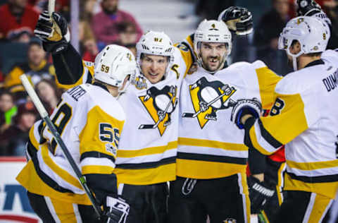 Mar 13, 2017; Calgary, Alberta, CAN; Pittsburgh Penguins center Sidney Crosby (87) celebrates with teammates after scoring a goal against the Calgary Flames during the third period at Scotiabank Saddledome. Calgary Flames won 4-3. Mandatory Credit: Sergei Belski-USA TODAY Sports