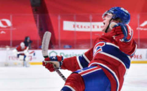 MONTREAL, QC – MAY 03: Cole Caufield #22 of the Montreal Canadiens celebrates his game winning goal at the Bell Centre on May 3, 2021 in Montreal, Canada. The Montreal Canadiens defeated the Toronto Maple Leafs 3-2 in overtime. (Photo by Minas Panagiotakis/Getty Images)