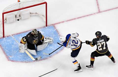 LAS VEGAS, NEVADA – FEBRUARY 13: Zach Sanford #12 of the St. Louis Blues scores his third goal of the game against Malcolm Subban #30 of the Vegas Golden Knights as Shea Theodore #27 of the Golden Knights defends in the second period of their game at T-Mobile Arena on February 13, 2020 in Las Vegas, Nevada. The Golden Knights defeated the Blues 6-5 in overtime. (Photo by Ethan Miller/Getty Images)