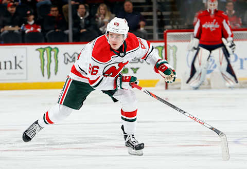 Jack Hughes #86, New Jersey Devils (Photo by Paul Bereswill/Getty Images)                                                                       New Jersey Devils- Kansas City Scouts Uniform with Devil’s 80’s Color Scheme