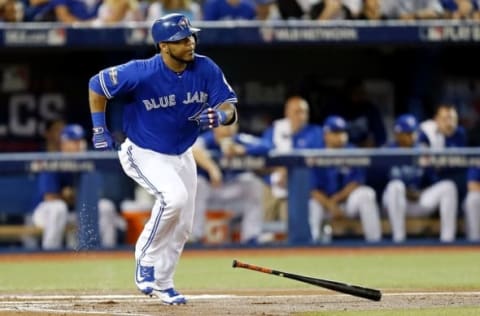 Oct 18, 2016; Toronto, Ontario, CAN; Toronto Blue Jays first baseman Edwin Encarnacion (10) hits a single during the first inning against the Cleveland Indians in game four of the 2016 ALCS playoff baseball series at Rogers Centre. Mandatory Credit: John E. Sokolowski-USA TODAY Sports