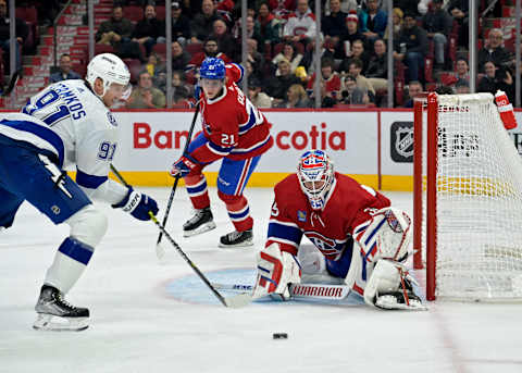 Nov 7, 2023; Montreal, Quebec, CAN; Montreal Canadiens goalie Sam Montembeault stops Steven Stamkos. Mandatory Credit: Eric Bolte-USA TODAY Sports