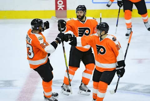 Oct 25, 2016; Philadelphia, PA, USA; Philadelphia Flyers right wing Jakub Voracek (93) celebrates with defenseman Radko Gudas (3) and right wing Matt Read (24) after scoring the game-winning goal during the shootout period against Buffalo Sabres at Wells Fargo Center. The Flyers defeated the Sabres 4-3 in a shootout. Mandatory Credit: Eric Hartline-USA TODAY Sports