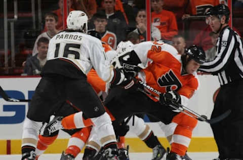 PHILADELPHIA: Riley Cote #32 of the Philadelphia Flyers is hit by George Parros #16 of the Anaheim Ducks. (Photo by Bruce Bennett/Getty Images)