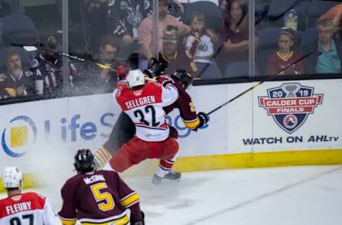 ROSEMONT, IL – JUNE 05: Charlotte Checkers Jesper Sellgren checks Chicago Wolves defenseman Jake Bischoff (28) in the third period during game three of the AHL Calder Cup Finals between the Charlotte Checkers and the Chicago Wolves on June 5, 2019, at the Allstate Arena in Rosemont, IL. (Photo by Patrick Gorski/Icon Sportswire via Getty Images)