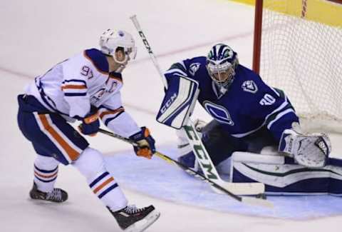 NHL Western Conference: Vancouver Canucks goaltender Ryan Miller (30) stops a shot on net by Edmonton Oilers forward Connor McDavid (97) during the third period at Rogers Arena. The Edmonton Oilers won 2-0. Mandatory Credit: Anne-Marie Sorvin-USA TODAY Sports