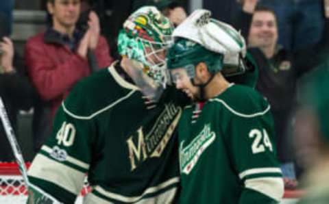 Jan 21, 2017; Saint Paul, MN, USA; Minnesota Wild goalie Devan Dubnyk (40) celebrates with defenseman Matt Dumba (24) following the game against the Anaheim Ducks at Xcel Energy Center. The Wild defeated the Ducks 5-3. Mandatory Credit: Brace Hemmelgarn-USA TODAY Sports