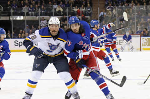 NEW YORK, NEW YORK – DECEMBER 05: Justin Faulk #72 of the St. Louis Blues battles with Mika Zibanejad #93 of the New York Rangers at Madison Square Garden on December 05, 2022, in New York City. The Rangers defeated the Blues 6-4. (Photo by Bruce Bennett/Getty Images)