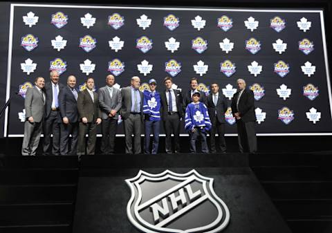 Jun 26, 2015; Sunrise, FL, USA; Mitchell Marner poses for a photo with team executives after being selected as the number four overall pick to the Toronto Maple Leafs in the first round of the 2015 NHL Draft at BB&T Center. Mandatory Credit: Steve Mitchell-USA TODAY Sports