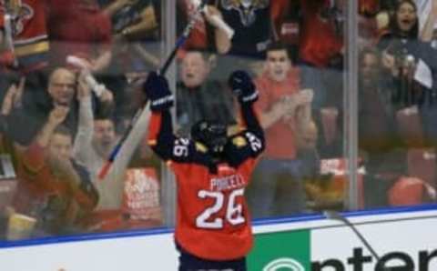 Apr 14, 2016; Sunrise, FL, USA; Florida Panthers right wing Teddy Purcell (26) celebrates after his goal past New York Islanders goalie Thomas Greiss (1) in the first period on the first round of the 2016 Stanley Cup Playoffs at BB&T Center. Mandatory Credit: Robert Mayer-USA TODAY Sports