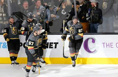 LAS VEGAS, NV – DECEMBER 19: Vegas Golden Knights players celebrate after Vegas Golden Knights defenseman Shea Theodore (27) scores the winning goal during the third period of a regular season NHL game between the Tampa Bay Lightning and the Vegas Golden Knights at T-Mobile Arena on Tuesday, Dec. 19, 2017, in Las Vegas. The Vegas Golden Knights would defeat the Tampa Bay Lightning 4-3. (Photo by: Marc Sanchez/Icon Sportswire via Getty Images)