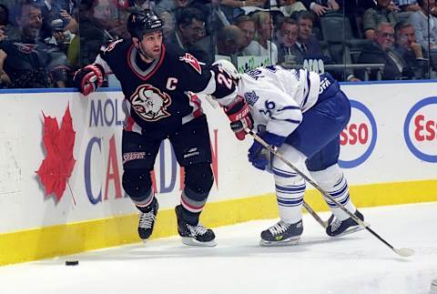 TORONTO, ON – MAY 23: Dmitri Yushkevich #36 of the Toronto Maple Leafs skates against Mike Peca #27 of the Buffalo Sabres during the 1999 NHL Semi-Final playoff game action at Air Canada Centre in Toronto, Ontario, Canada. (Photo by Graig Abel/Getty Images)