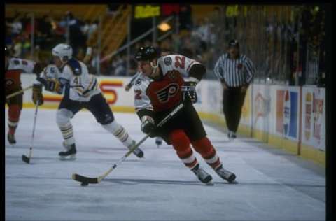 Nov 1991: Rightwinger Rick Tocchet of the Philadelphia Flyers (right) moves the puck during a game against the Buffalo Sabres at Memorial Auditorium in Buffalo, New York. Mandatory Credit: Rick Stewart /Allsport