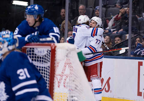 TORONTO, ON – DECEMBER 28: New York Rangers defenseman Tony DeAngelo (77) celebrates scoring the winning goal with New York Rangers left wing Artemi Panarin (10) in the overtime period in a game on December 28, 2019, at Scotiabank Arena in Toronto, Ontario Canada.(Photo by Nick Turchiaro/Icon Sportswire via Getty Images)