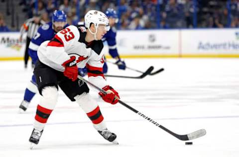 TAMPA, FLORIDA – MARCH 19: Nolan Foote #25 of the New Jersey Devils looks to pass in the third period during a game against the Tampa Bay Lightning at Amalie Arena on March 19, 2023 in Tampa, Florida. (Photo by Mike Ehrmann/Getty Images)