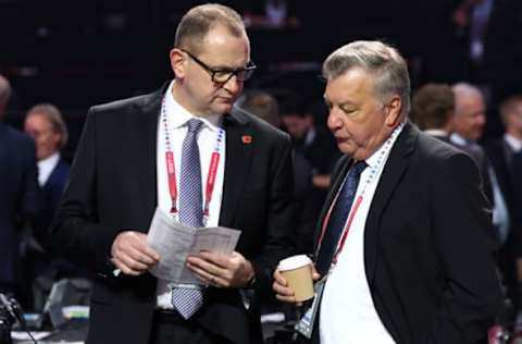 MONTREAL, QUEBEC – JULY 08: General manager Brad Treliving of the Calgary Flames and general manager Don Waddell of the Carolina Hurricanes talk on the draft floor prior to Round Two of the 2022 Upper Deck NHL Draft at Bell Centre on July 08, 2022, in Montreal, Quebec, Canada. (Photo by Bruce Bennett/Getty Images)