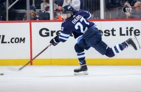 WINNIPEG, MB – OCTOBER 16: Nikolaj Ehlers #27 of the Winnipeg Jets shoots the puck during third period action against the Edmonton Oilers at the Bell MTS Place on October 16, 2018 in Winnipeg, Manitoba, Canada. The Oilers defeated the Jets 5-4 in overtime. (Photo by Jonathan Kozub/NHLI via Getty Images)