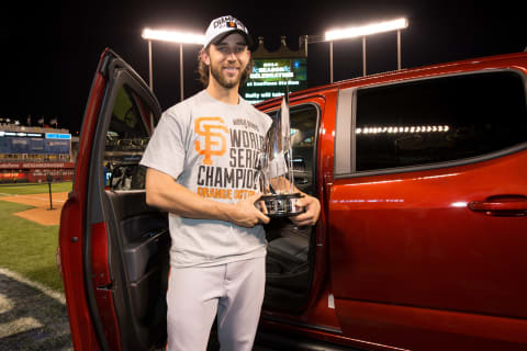 KANSAS CITY, MO – OCTOBER 29: Madison Bumgarner #40 of the San Francisco Giants poses with the MVP trophy and a Chevrolet Colorado after the Giants defeated the Kansas City Royals in Game 7 of the 2014 World Series on Wednesday, October 29, 2014 at Kauffman Stadium in Kansas City, Missouri. (Photo by Ron Vesely/MLB Photos via Getty Images)