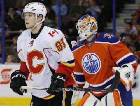 Jan 16, 2016; Edmonton, Alberta, CAN; Calgary Flames forward Sam Bennett (93) tries to screen Edmonton Oilers goaltender Cam Talbot (33) during the first period at Rexall Place. Mandatory Credit: Perry Nelson-USA TODAY Sports