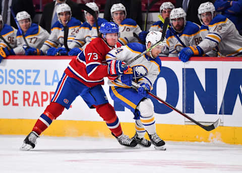 MONTREAL, QC – FEBRUARY 13: Tyler Toffoli #73 of the Montreal Canadiens and Rasmus Asplund #74 of the Buffalo Sabres skate against each other during the third period at Centre Bell on February 13, 2022 in Montreal, Canada. The Buffalo Sabres defeated the Montreal Canadiens 5-3. (Photo by Minas Panagiotakis/Getty Images)