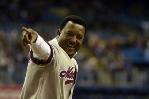 Apr 1, 2016; Montreal, Quebec, CAN; Former Montreal Expos player Martinez salutes the crowd during a ceremony before the game between the Boston Red Sox and the Toronto Blue Jays at Olympic Stadium. Mandatory Credit: Eric Bolte-USA TODAY Sports