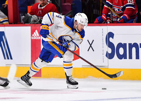 MONTREAL, QC – FEBRUARY 13: Rasmus Asplund #74 of the Buffalo Sabres skates the puck against the Montreal Canadiens during the third period at Centre Bell on February 13, 2022 in Montreal, Canada. The Buffalo Sabres defeated the Montreal Canadiens 5-3. (Photo by Minas Panagiotakis/Getty Images)