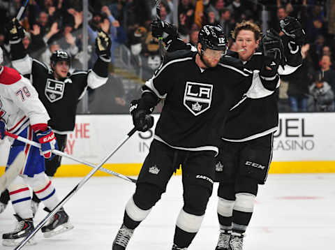 March 5, 2015; Los Angeles, CA, USA; Los Angeles Kings center Anze Kopitar (11) and center Tyler Toffoli (73) celebrate the goal scored by right-wing Marian Gaborik (12) against the Montreal Canadiens during the third period at Staples Center. Mandatory Credit: Gary A. Vasquez-USA TODAY Sports