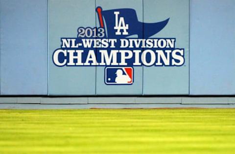 LOS ANGELES, CA – SEPTEMBER 28: The Los Angeles Dodgers unvail their 2013 National League West Division Championship banner before the game against the Colorado Rockies at Dodger Stadium on September 27, 2013 in Los Angeles, California. (Photo by Lisa Blumenfeld/Getty Images)