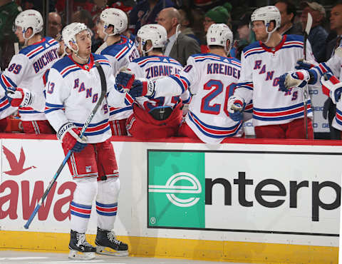 NEWARK, NJ – APRIL 03: Kevin Hayes #13 of the New York Rangers celebrates his goal with his team bench during the game against the New Jersey Devils at Prudential Center on April 3, 2018 in Newark, New Jersey. (Photo by Andy Marlin/NHLI via Getty Images)